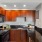 a kitchen with wooden cabinets