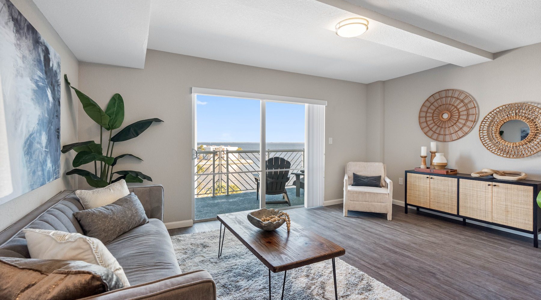 Generous living spaces to relax and unwind living room with couch plants and art on the wall