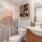 a well-lit bathroom with a sink and a toilet