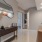 an entry with furniture and a mirror