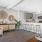 a large living room with a dining table and a couch