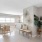 a living room with a table and chairs