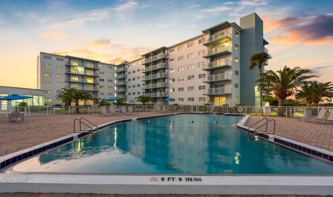 Shimmering resort-style pool a hotel with a pool
