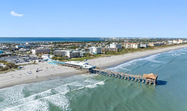The essence of exceptional living a beach with buildings and water