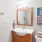 a bathroom with a mirror and a sink